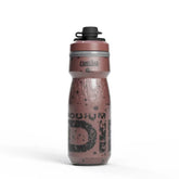 A red Camelbak Podium Dirt Series Chill 21oz water bottle designed for cycling, with a dirt and splatter graphic pattern.